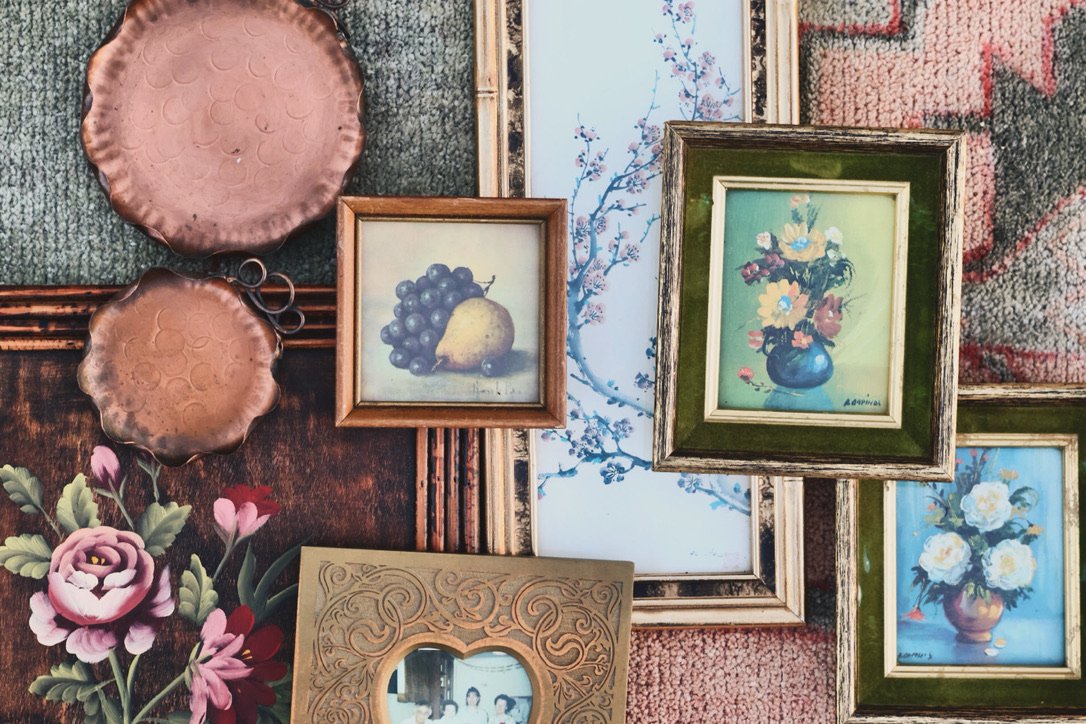 vintage gallery wall art featuring copper wall plates, mini framed still life, framed art and picture frame