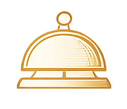 Gold-colored service bell on a wooden surface.