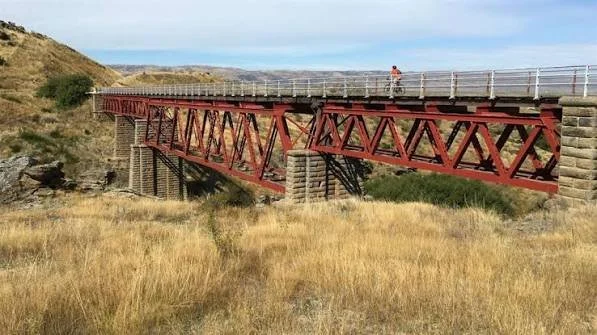 Riding bicycles over bridges through Central Otago