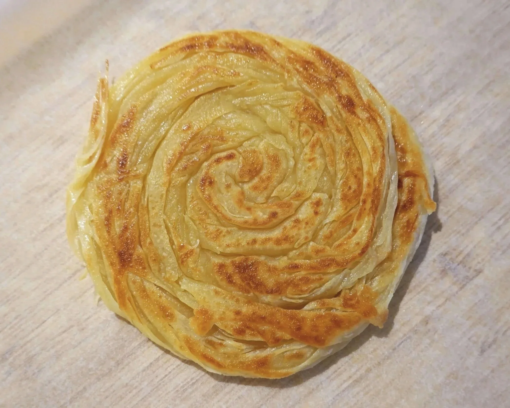 A close-up view of freshly pan-fried roti