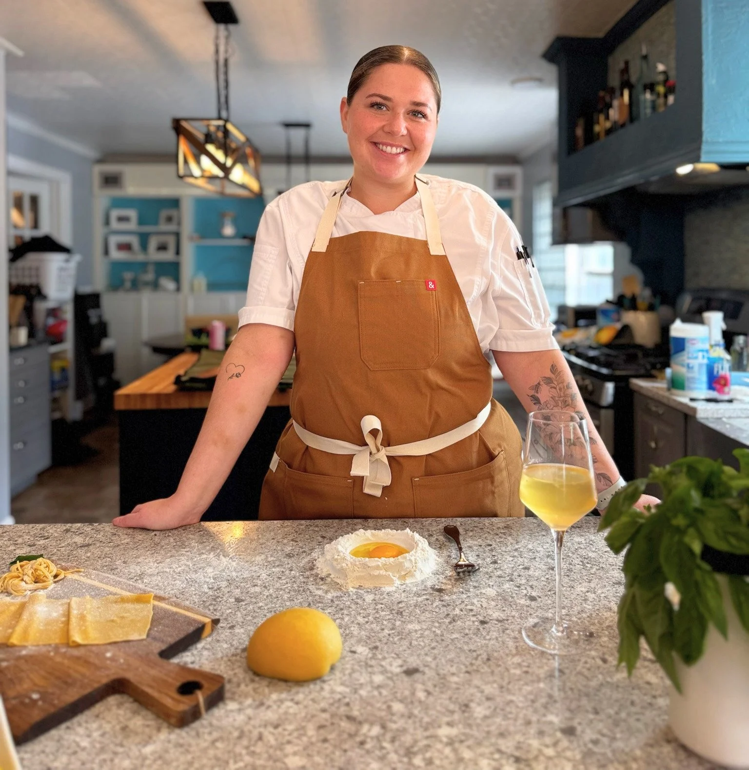 Chef Lizzie in the kitchen preparing a meal for The Kitchen Party