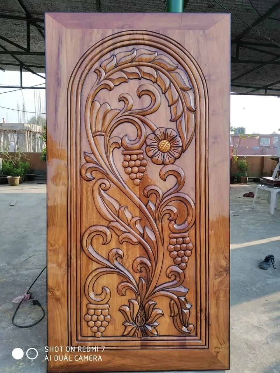 Exquisitely Carved Wooden Door with Floral and Grapevine Design