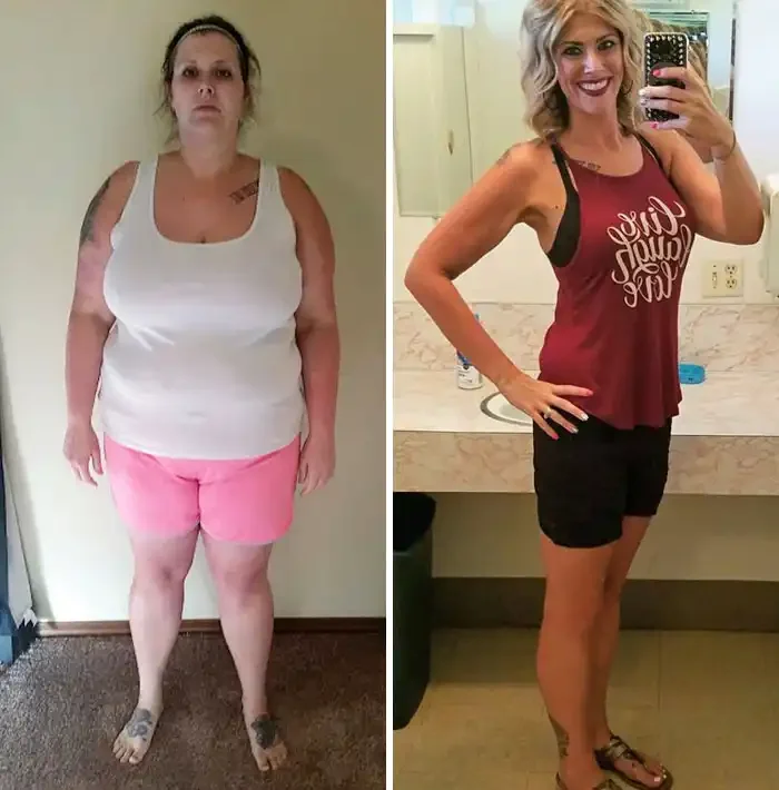 Side-by-side comparison of a woman before and after weight loss. In the 'before' photo, she is standing indoors with a serious expression, wearing a white tank top and pink shorts. In the 'after' photo, she is smiling, taking a mirror selfie in a bathroom, wearing a maroon tank top with white lettering and black shorts.