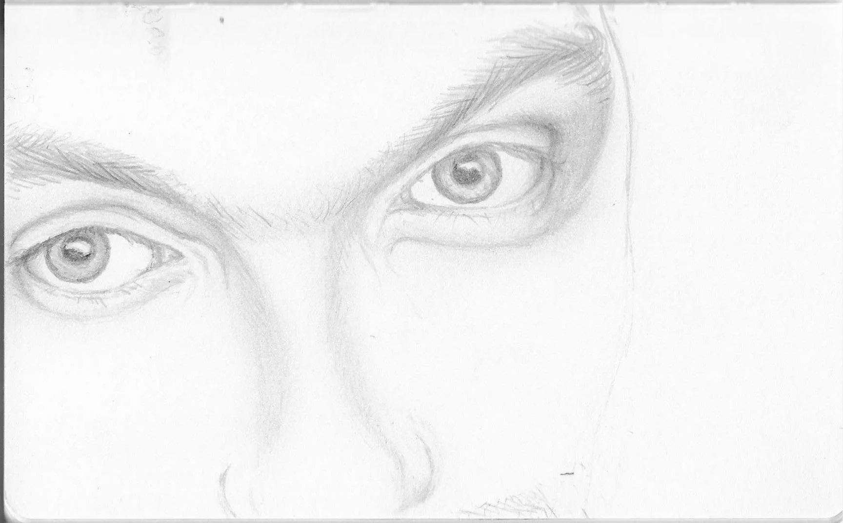 Pencil sketch of a person's eyes and eyebrows, with partial facial features.