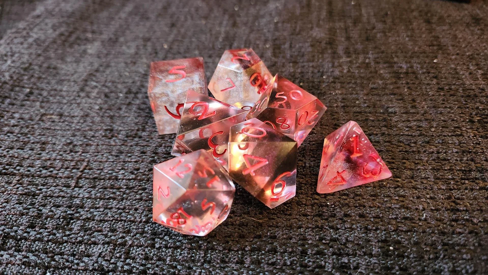An example of how a JoaraCrafts mystery dice pack might look like. This specific set has a thematic red and clear variant.