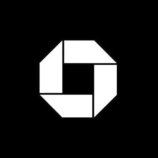 A black background with a white geometric shape resembling a camera shutter or aperture design.