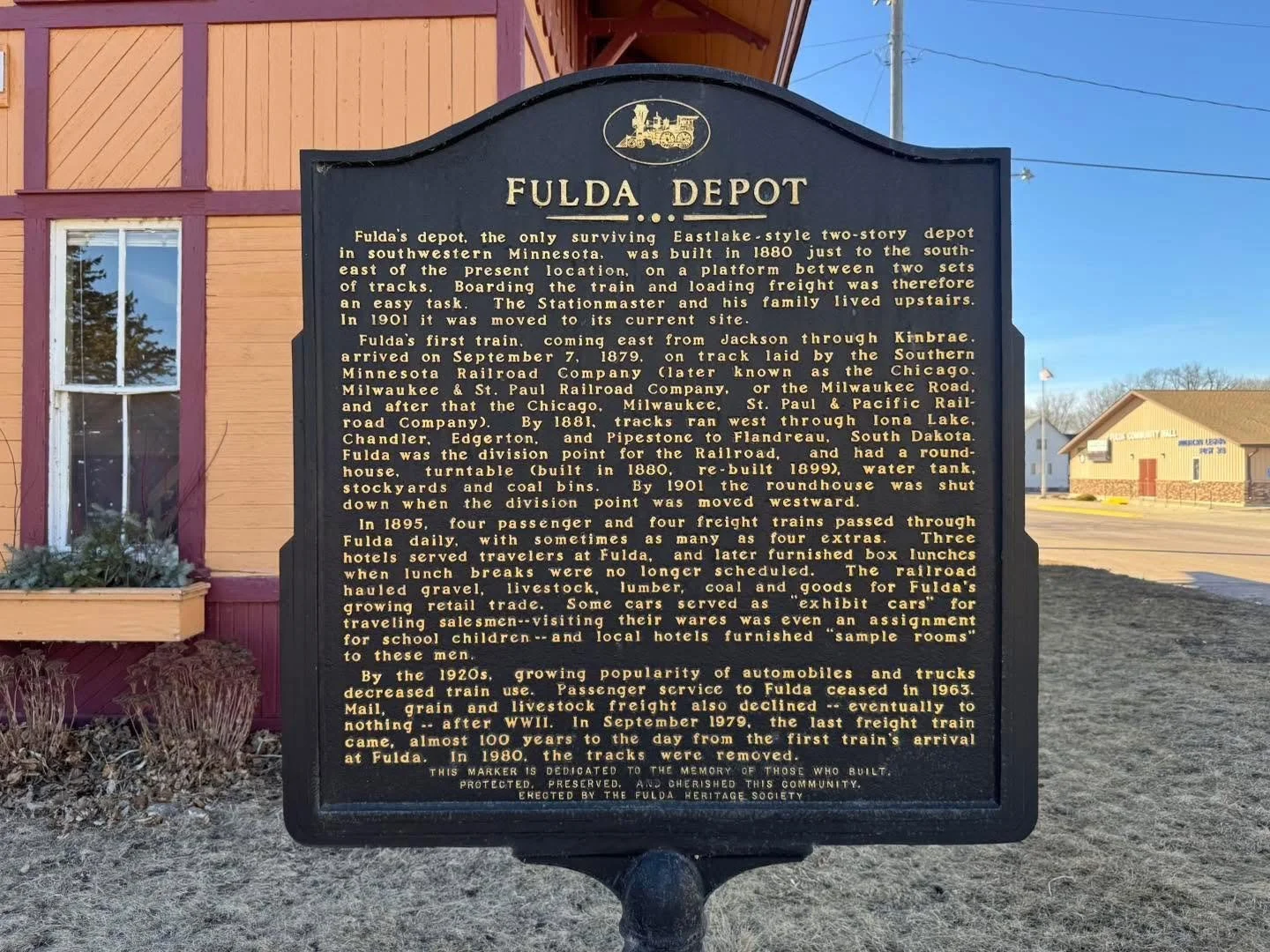 Historical marker about Fulda Depot in Minnesota, describing its history from 1880 to the 1980s, including details about trains, freight, and community use.