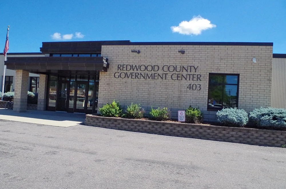 Front view of Redwood County Government Center building with sign and landscaping