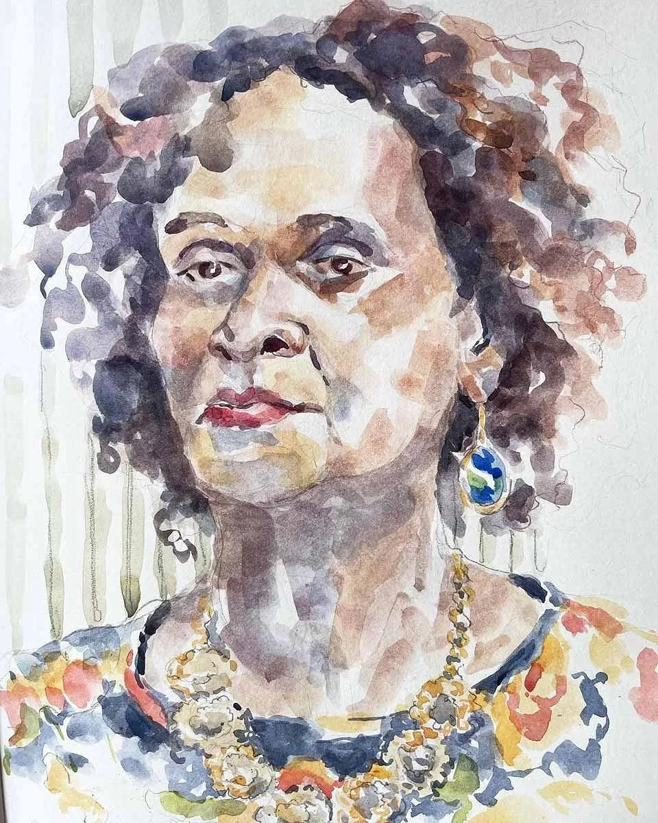 Watercolor portrait of a woman with curly, dark hair, wearing earrings and a colorful necklace.