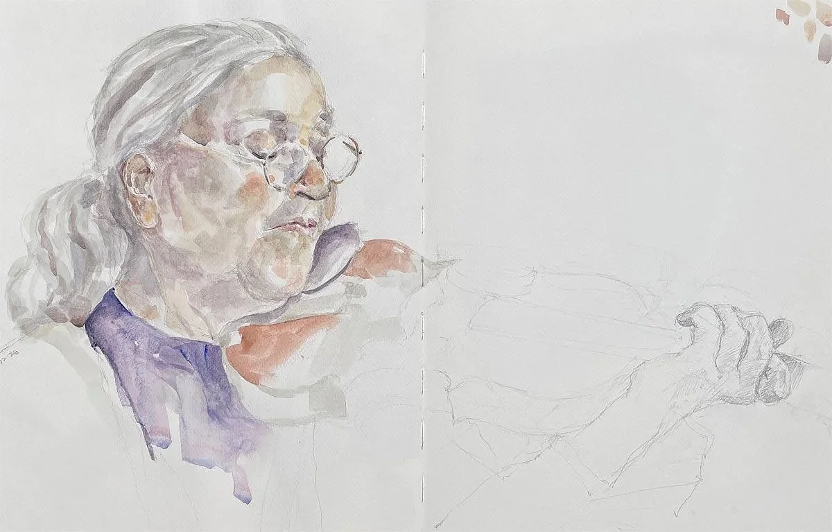 A watercolor portrait of an elderly woman with glasses and gray hair, sketching or drawing on paper, with a partially completed drawing of a person's face and hand.