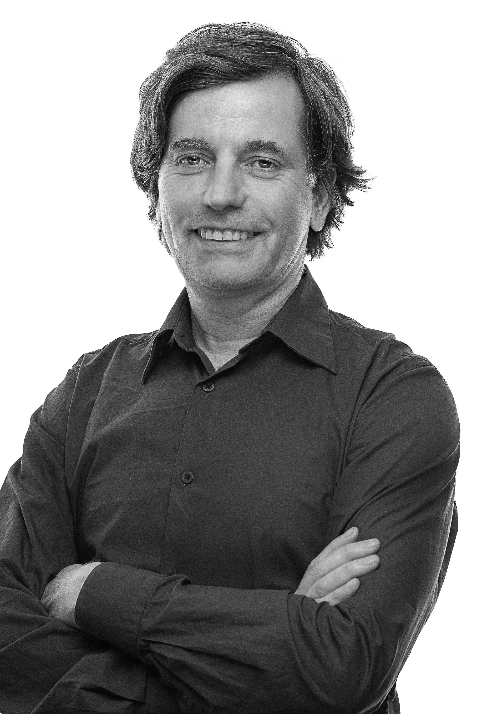 Architekturpublizist Christian Holl, Geschäftsführer des BDA Hessen und Herausgeber des Magazins Marlowes, in einer Schwarz-Weiß-Porträtaufnahme.