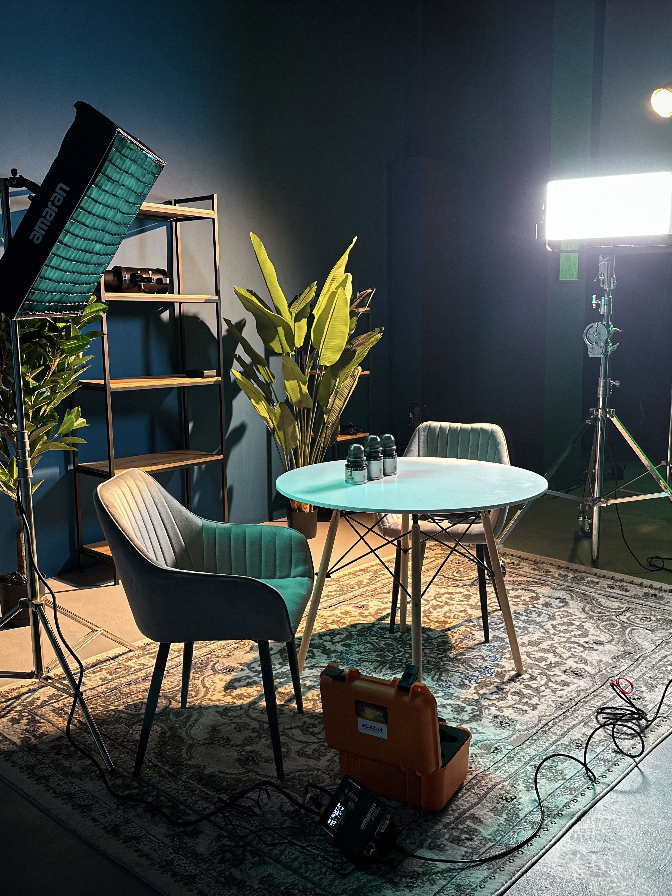 -film set with a table and chair, and an led light in a decorated room