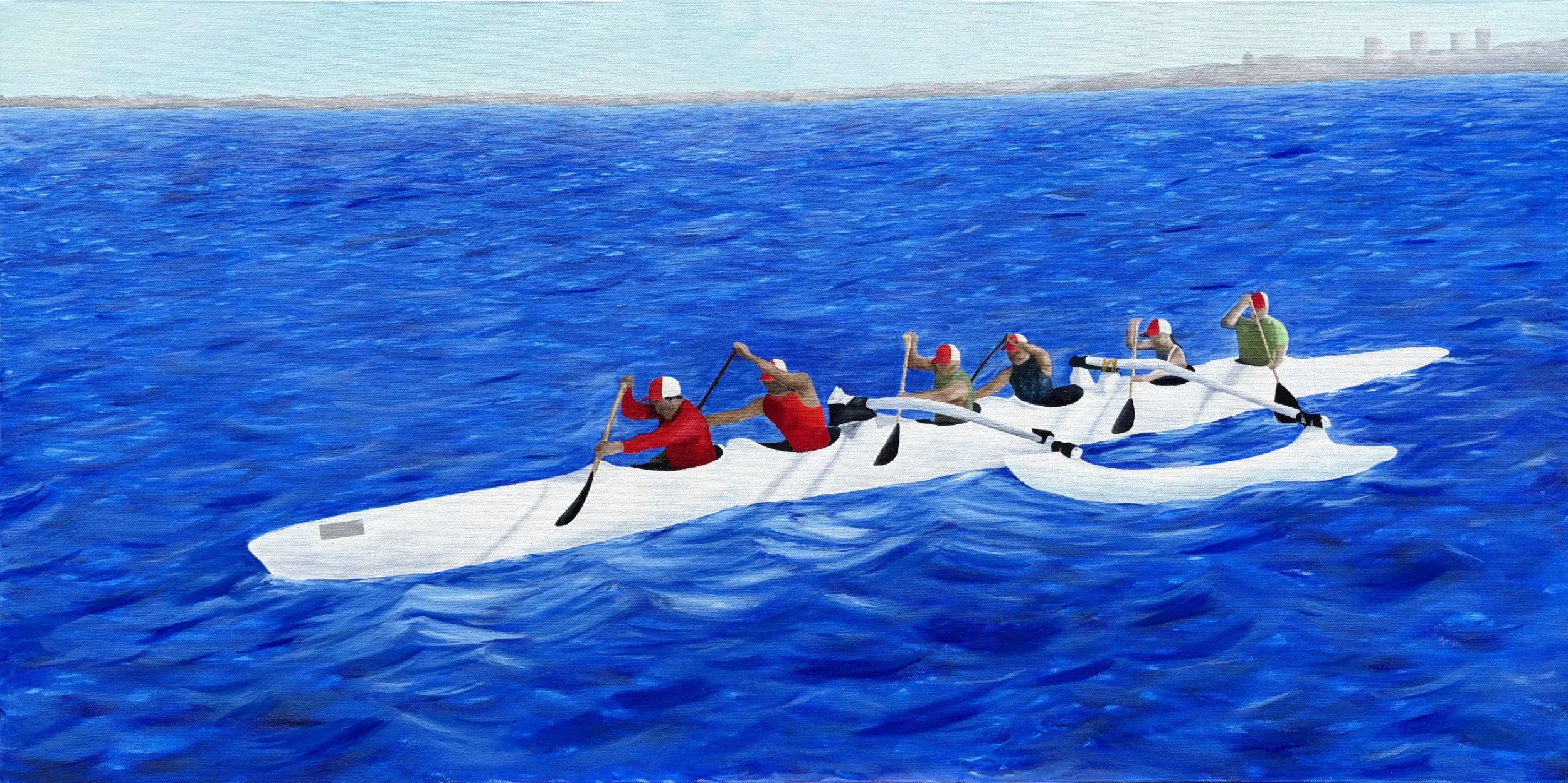 People paddling in an outrigger boat