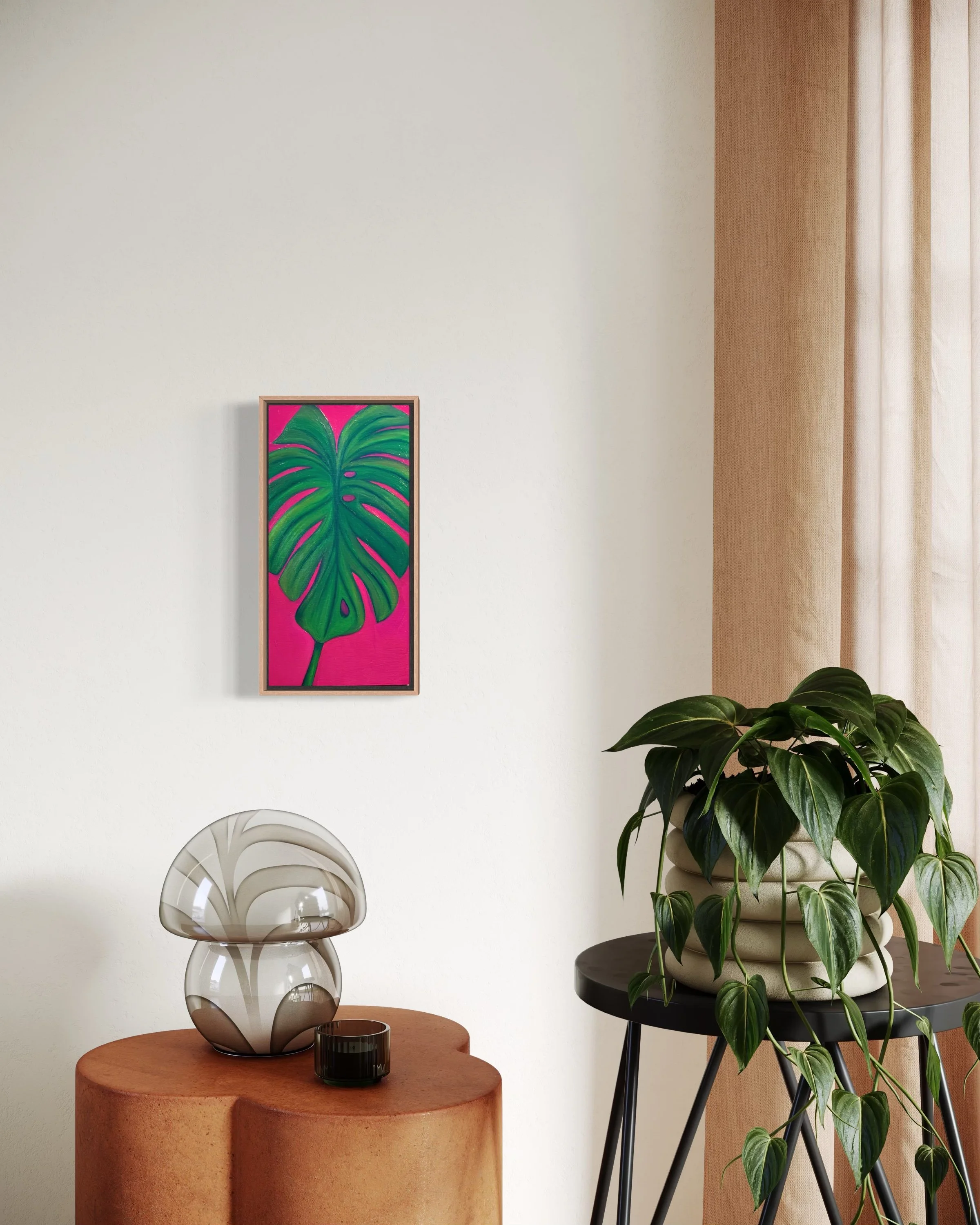 Painted green monstera leaf with pink background.