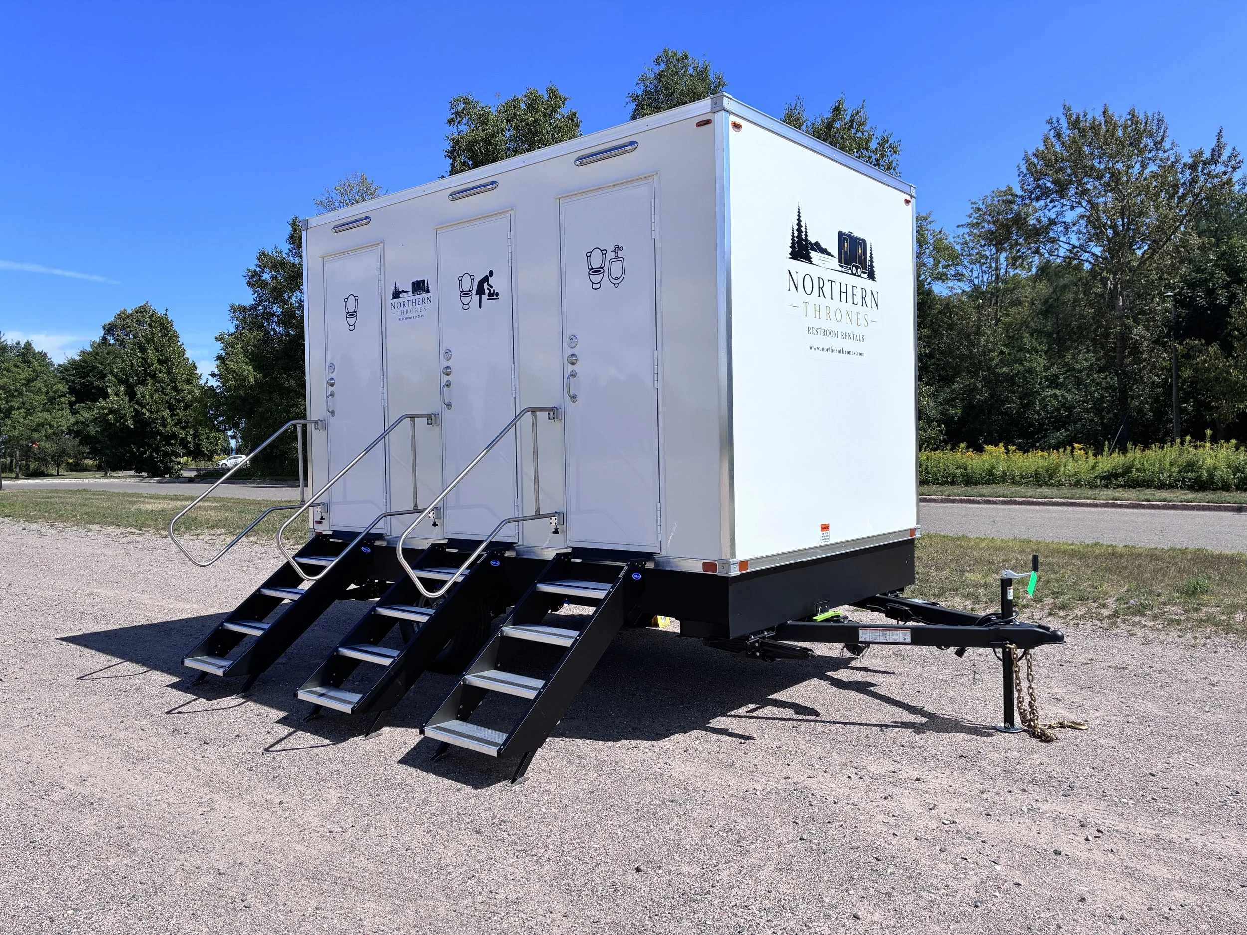 Northern Thrones Restroom Rental provides luxury restroom trailer with safety rails and stairs.