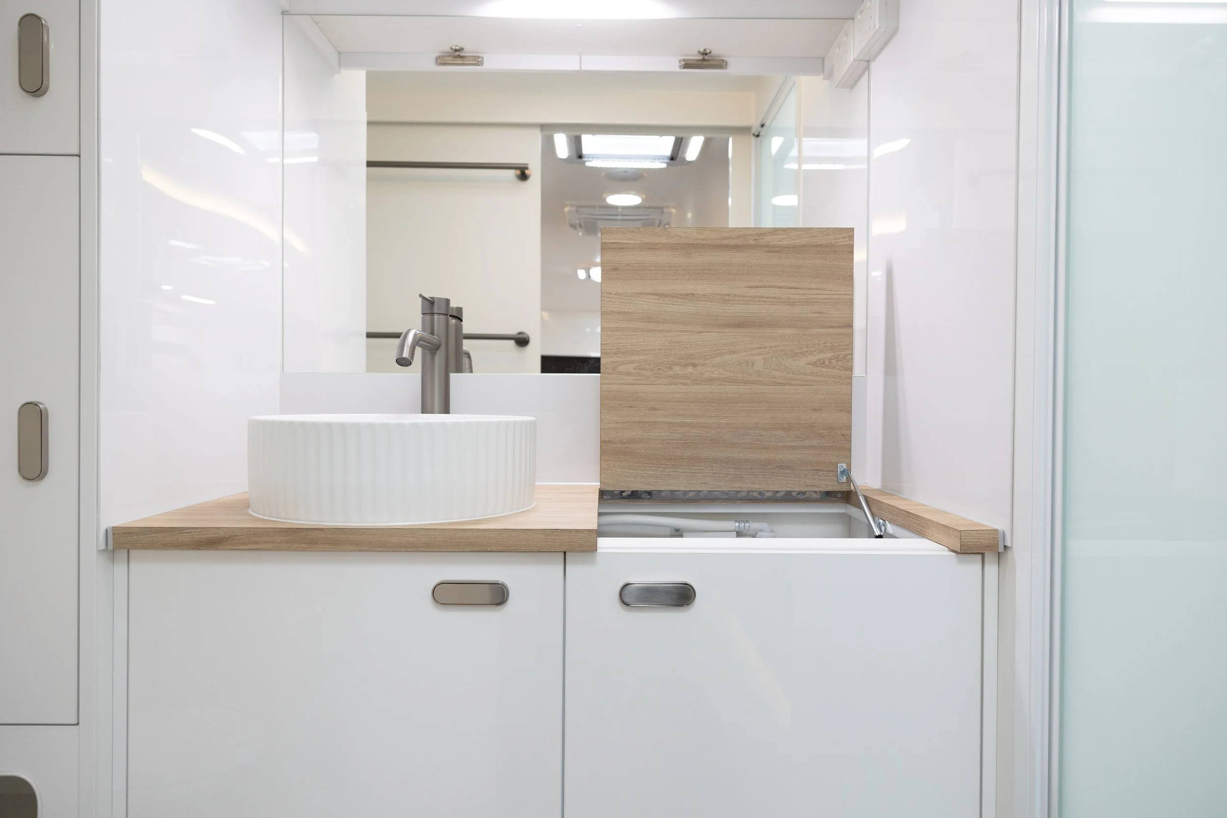 Bespoke Caravans Evoke luxury Australian caravans bathroom with inbuilt top loader washing machine