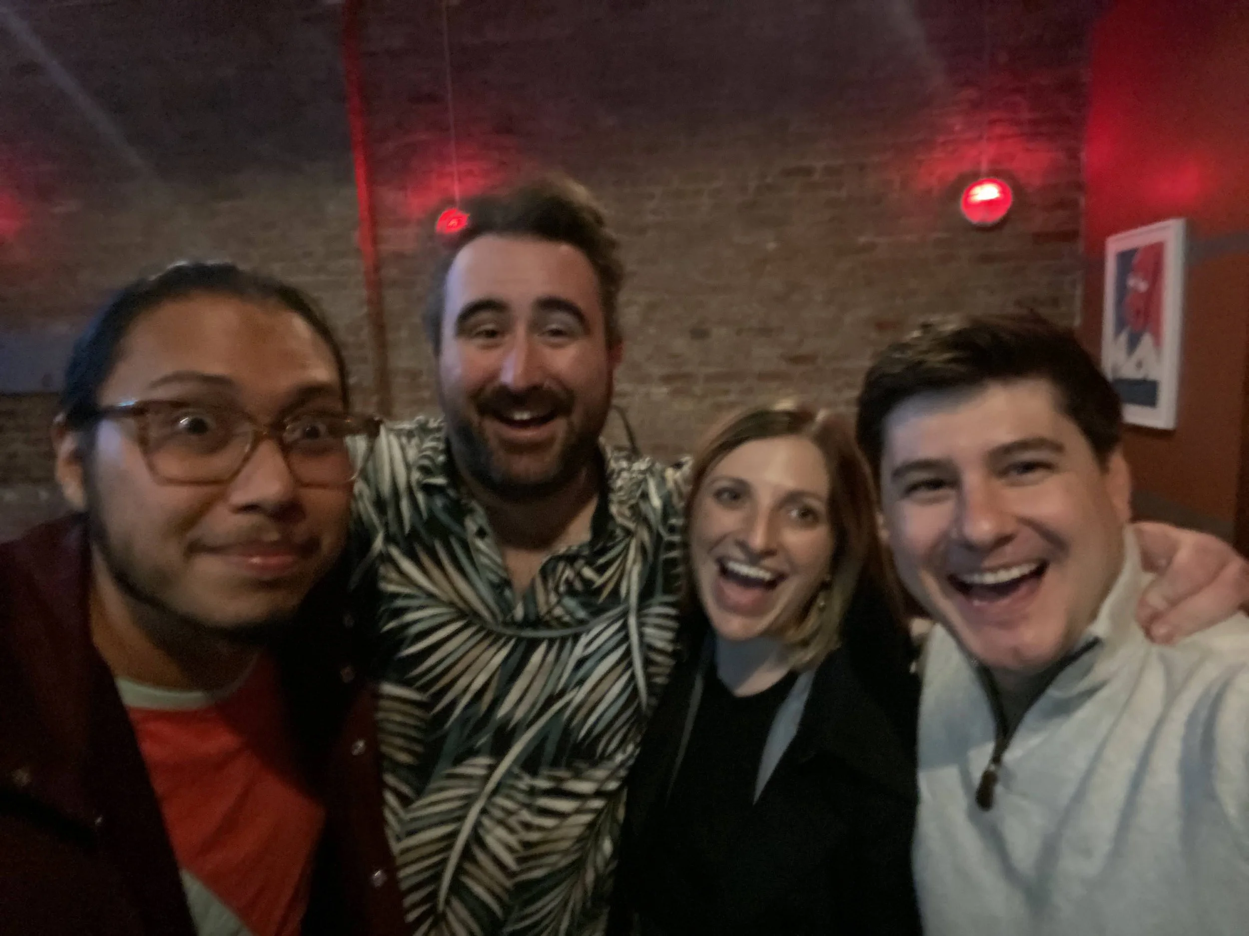 Four friends who just found out they won an Airbnb design contest.