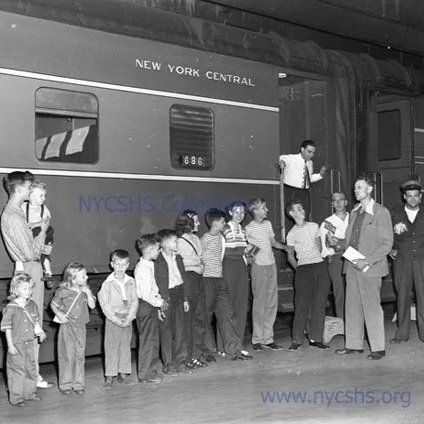 A family waits to board a New York Central System River Series Rail Car from the NYCHS archive