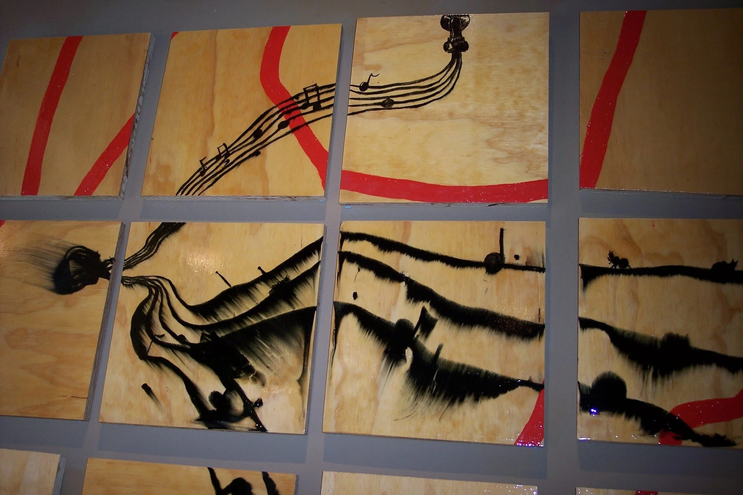 Multiple wooden panels with black ink sketches of insects and red brushstrokes.
