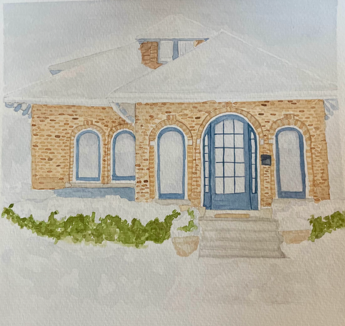 Watercolor painting of a brick house with blue accents, arched windows, and a large front door, surrounded by greenery.