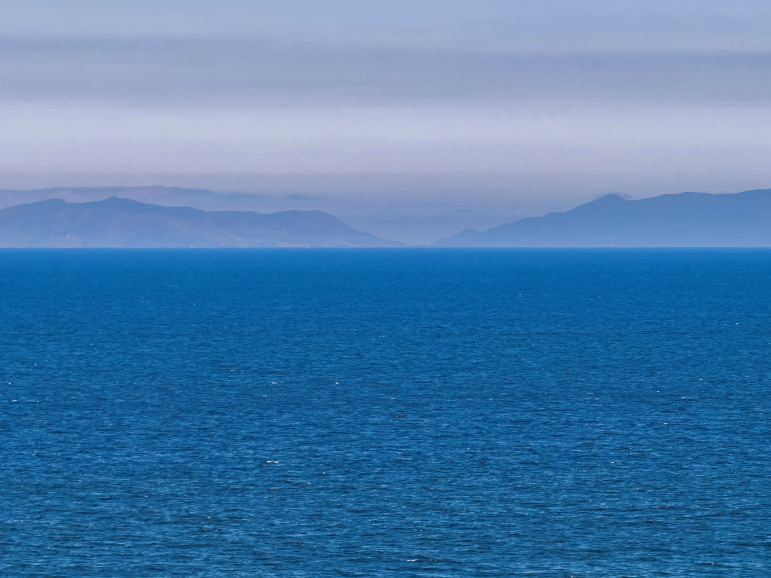 The Pacific Ocean with Catalina in the distance under, with marine layer.