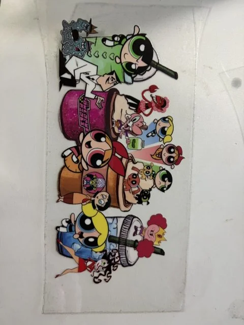 Colorful cartoon characters from The Powerpuff Girls, Dexter's Laboratory, and other animated shows on a white background.
