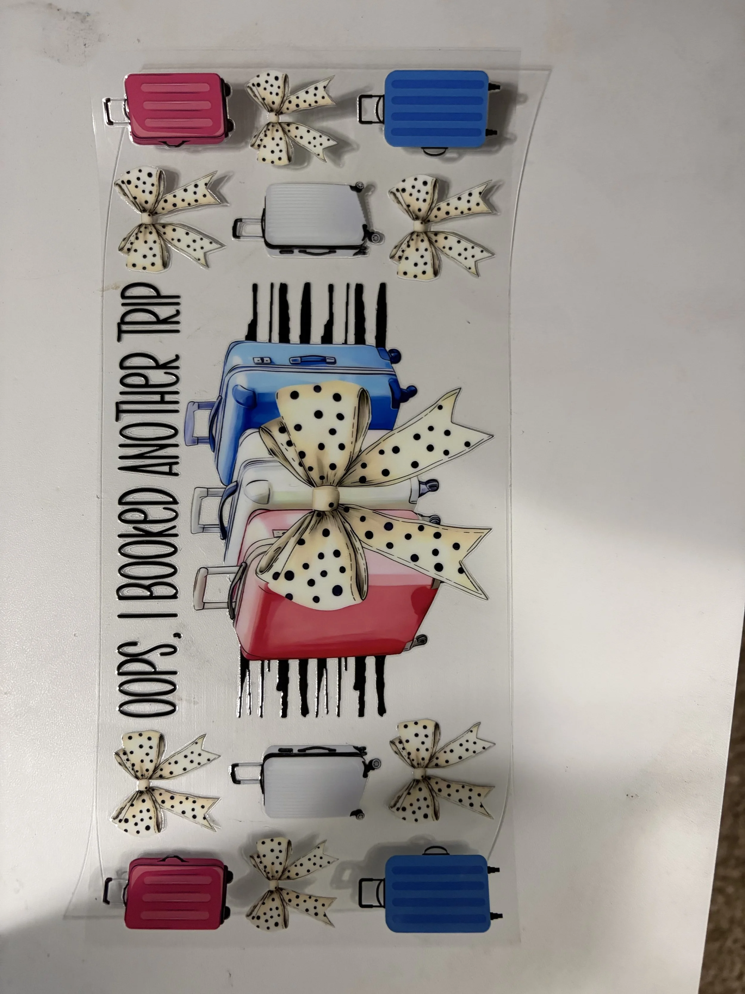Decorative sticker sheet featuring colorful suitcases, polka-dotted bows, and the phrase 'That's how I roll' in black text.