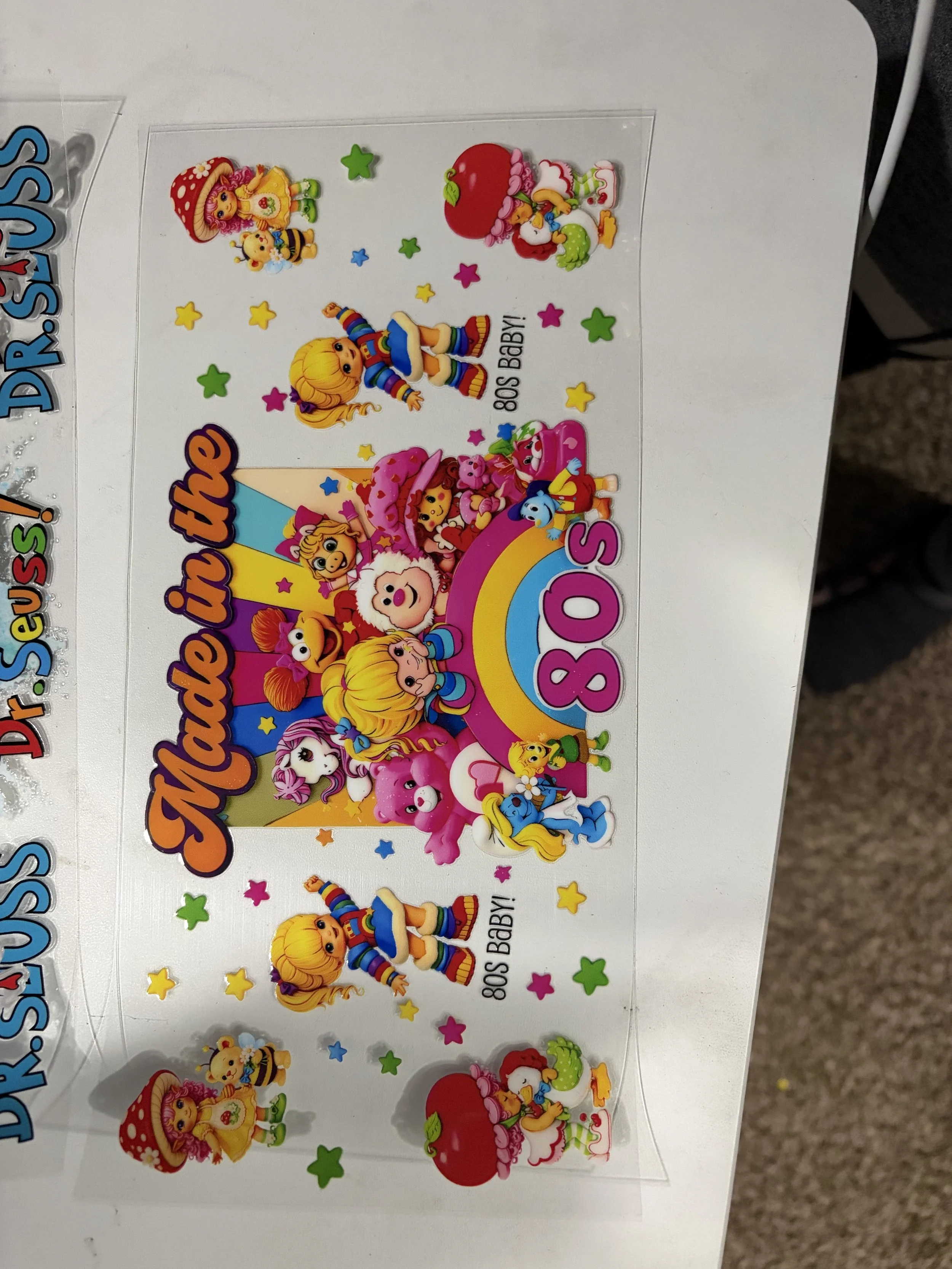 Colorful 80s baby-themed sticker sheet with cartoon characters, animals, stars, and love-themed elements.
