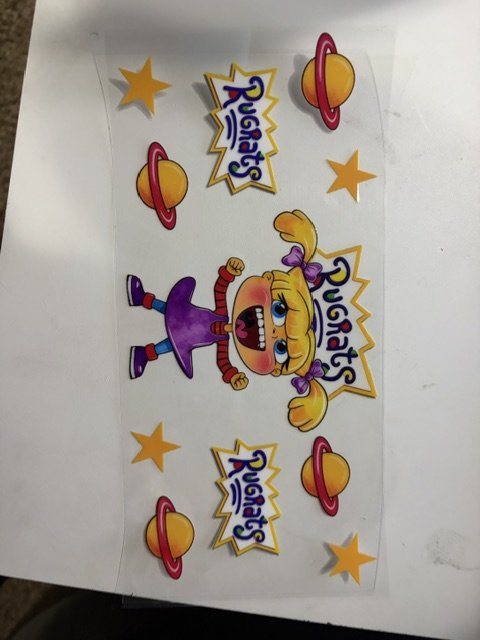 Colorful wall poster featuring a cartoon girl with pigtails, space-themed elements such as planets and stars, and the words "Cosmos" and "Planet".