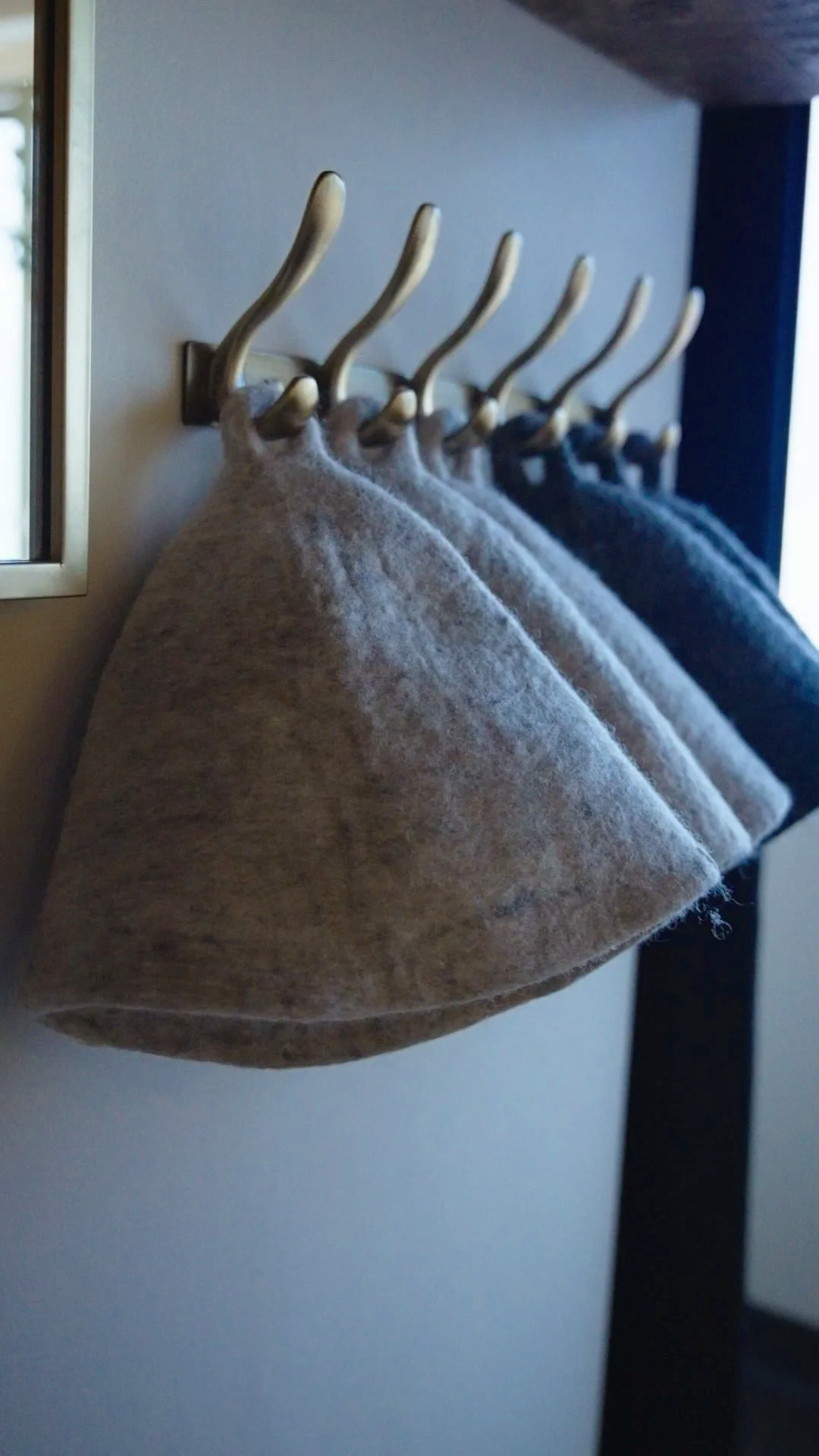 Sauna Hats and changing area at Contrast Recovery wellness studio.