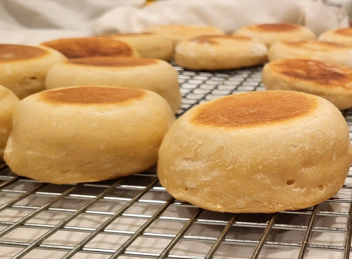 Close-up of freshly baked jin deui with golden brown tops cooling on a wire rack.