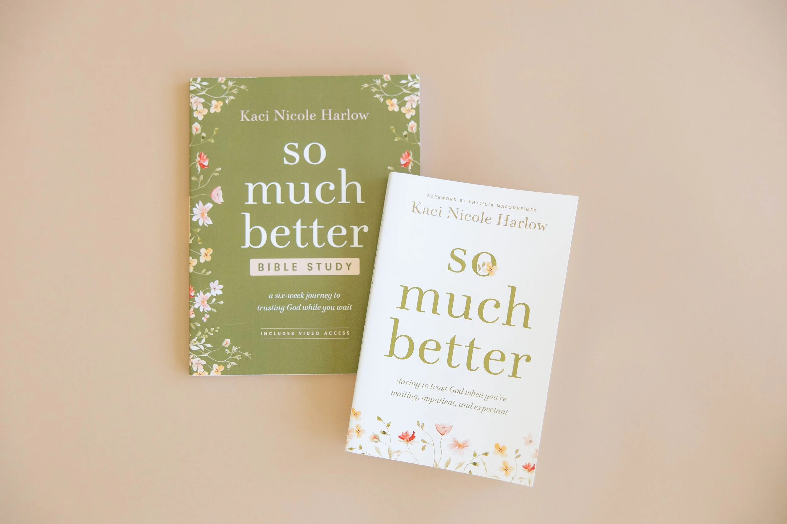 Two books titled "So Much Better" by Kaci Nicole Harlow, one with a green floral cover and the other with a white cover, placed on a beige background.