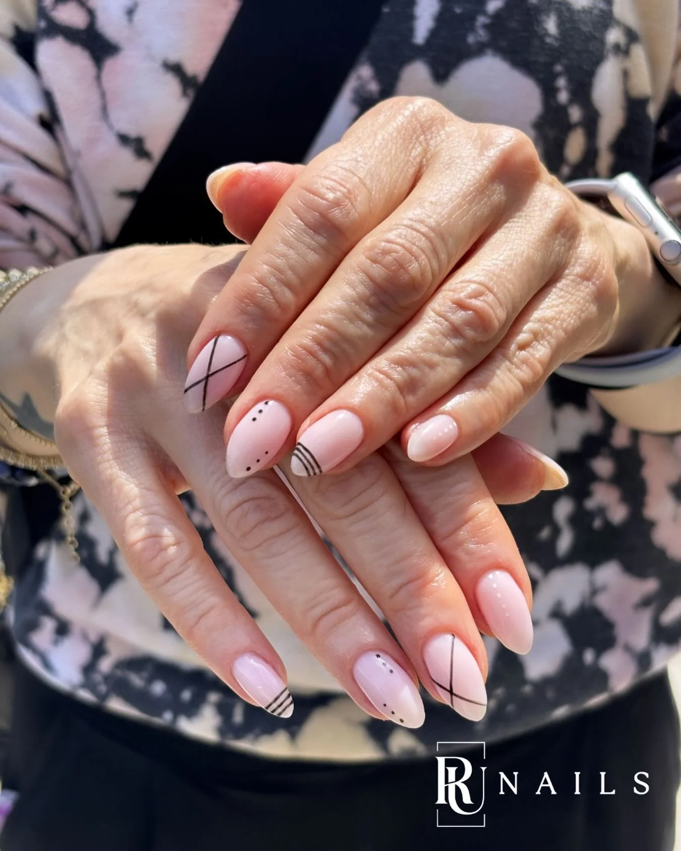 Minimalism with an edge.
Nude almond base, thin black lines, a few dots &mdash; all you need to make a statement without saying a word.

📍 Santa Monica | Book via link in bio

#MinimalistNails #NailArt #runails #hardgel #RussianManicure