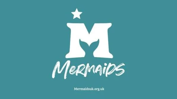 A teal background with a white stylized letter M shaped like a mermaid tail, a star above it, the word 'Mermaids' in handwritten font, and a website URL mermaidsuk.org.uk at the bottom.