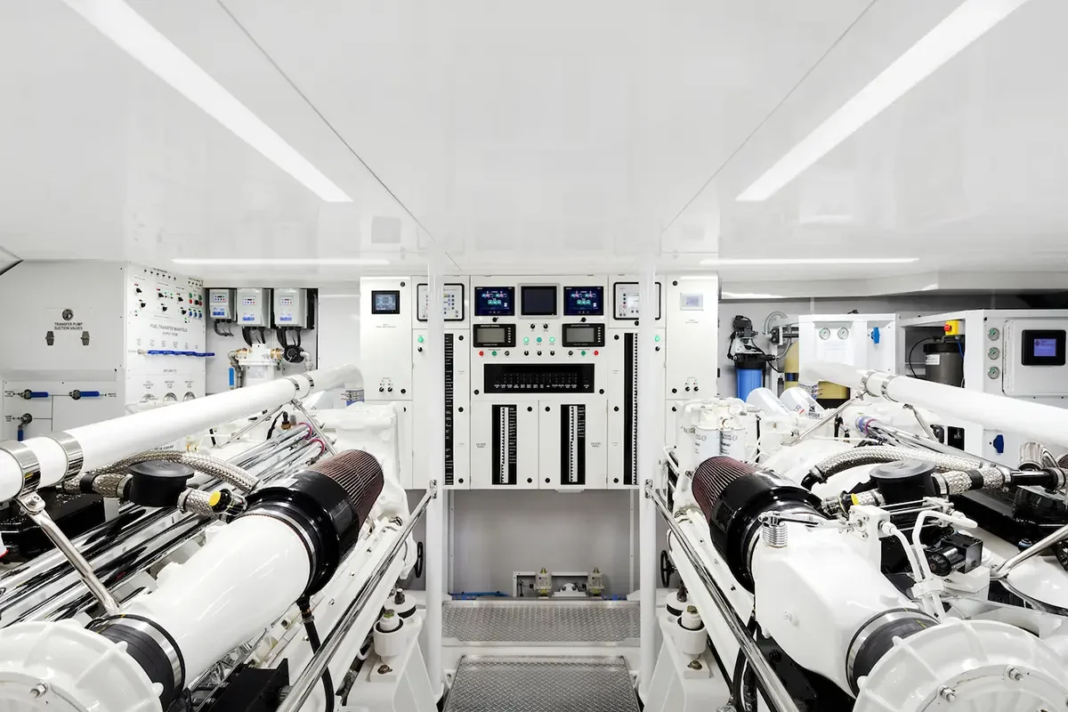 Interior of a cleanroom with high-tech scientific equipment and machinery, including control panels, pipes, and gauges.