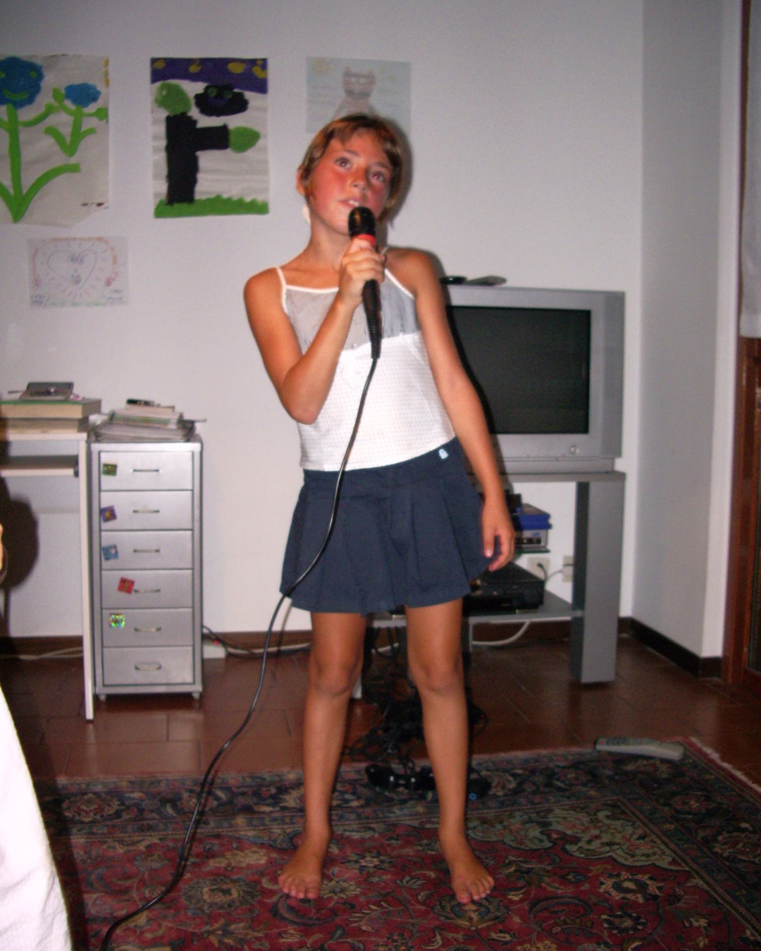 Young Alice singing in the living room.
