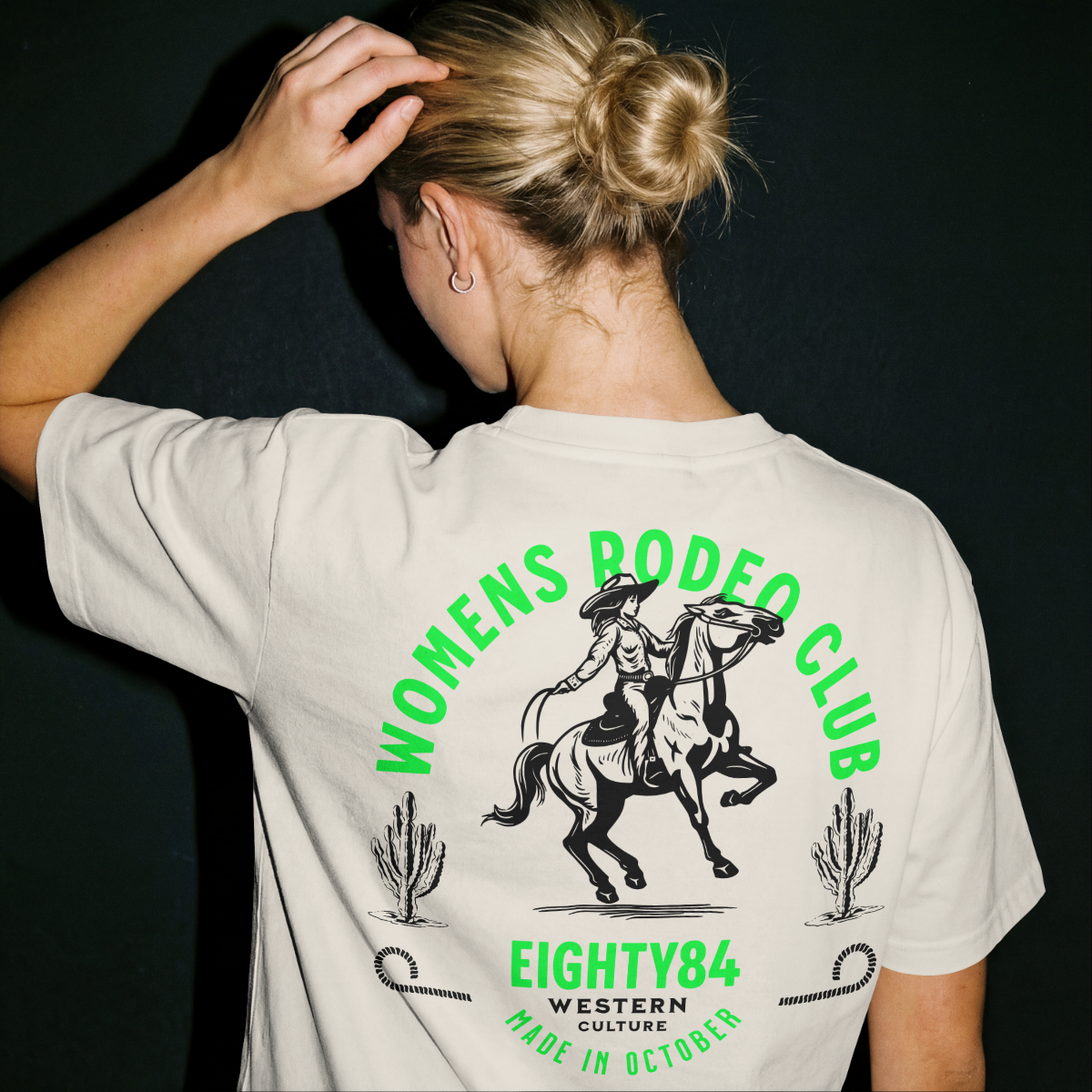 Back view of the Eighty84 Women's Rodeo Club graphic T-shirt featuring western-inspired artwork and premium streetwear design.