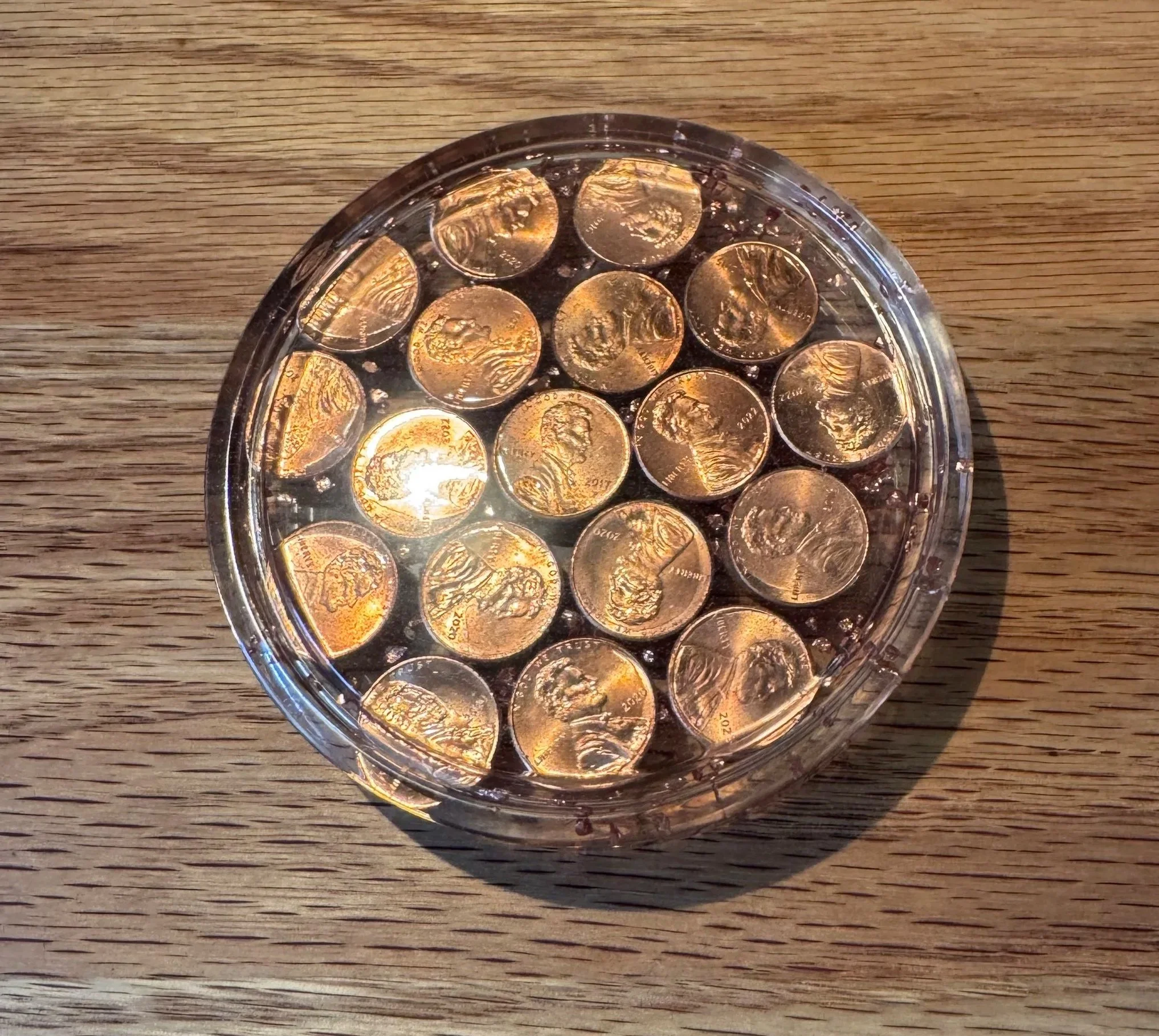 A coaster to commemorate the US penny with pennies embedded in crystal clear resin. 