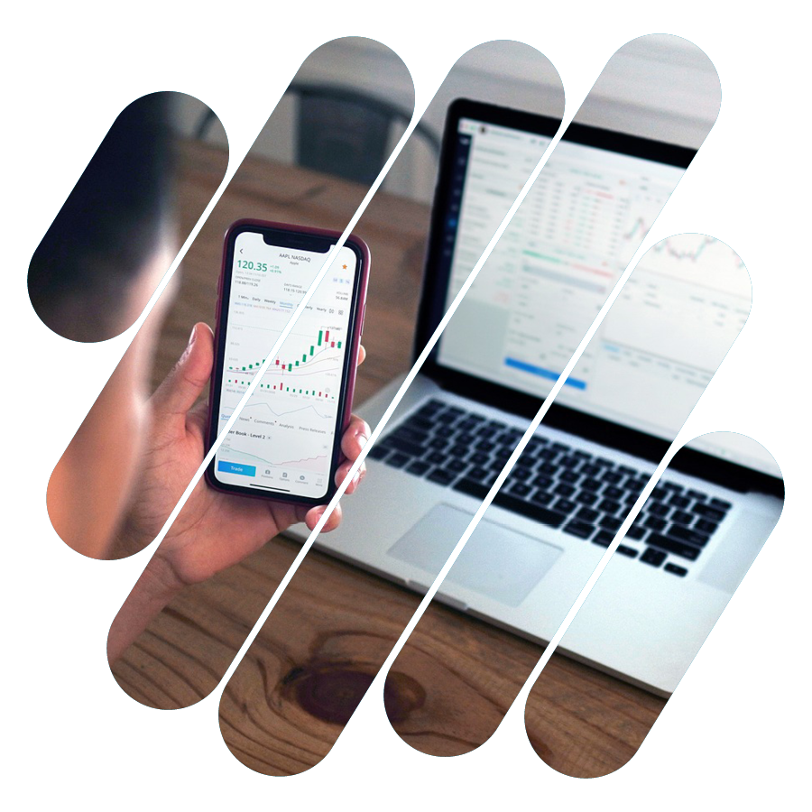 Hand holding phone displaying live portfolio trading data.