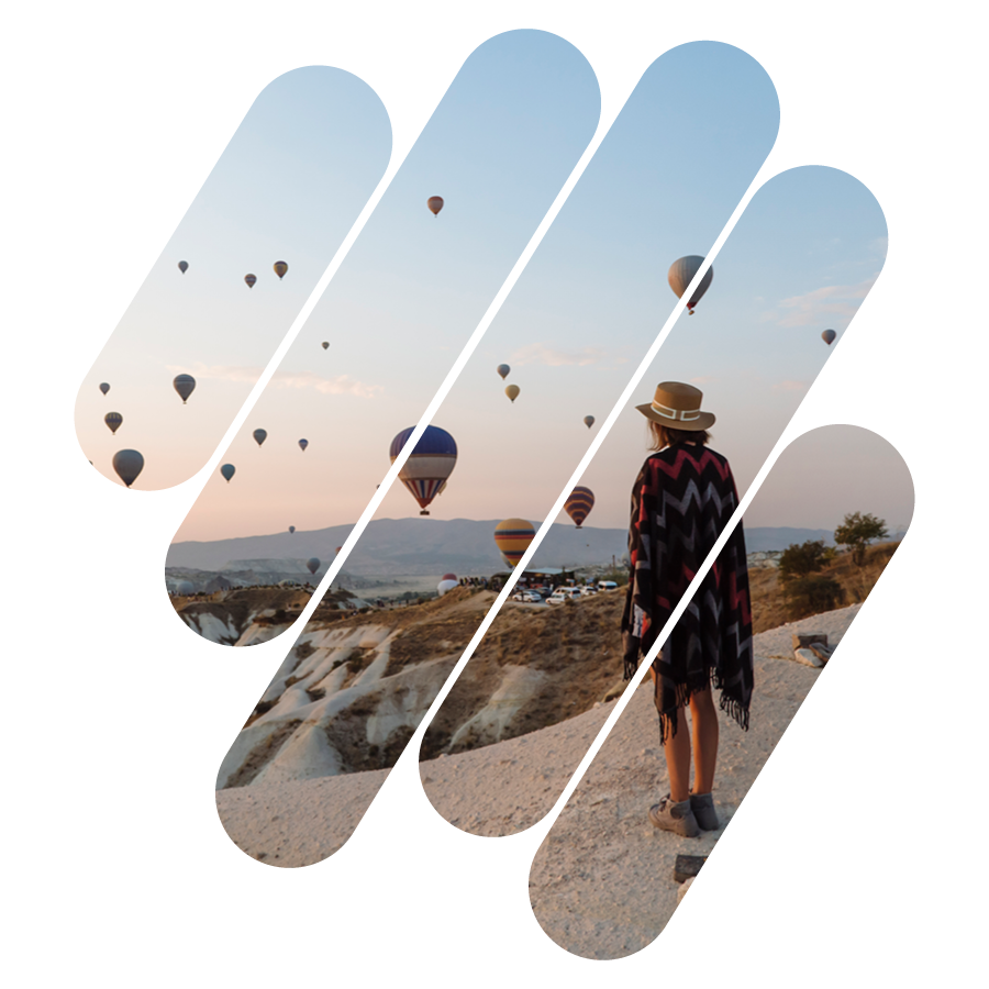 Woman viewing hot air balloons, reflecting Caliber Investment's balanced philosophy.