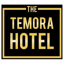 Sign for The Temora Hotel with gold text on a black background.