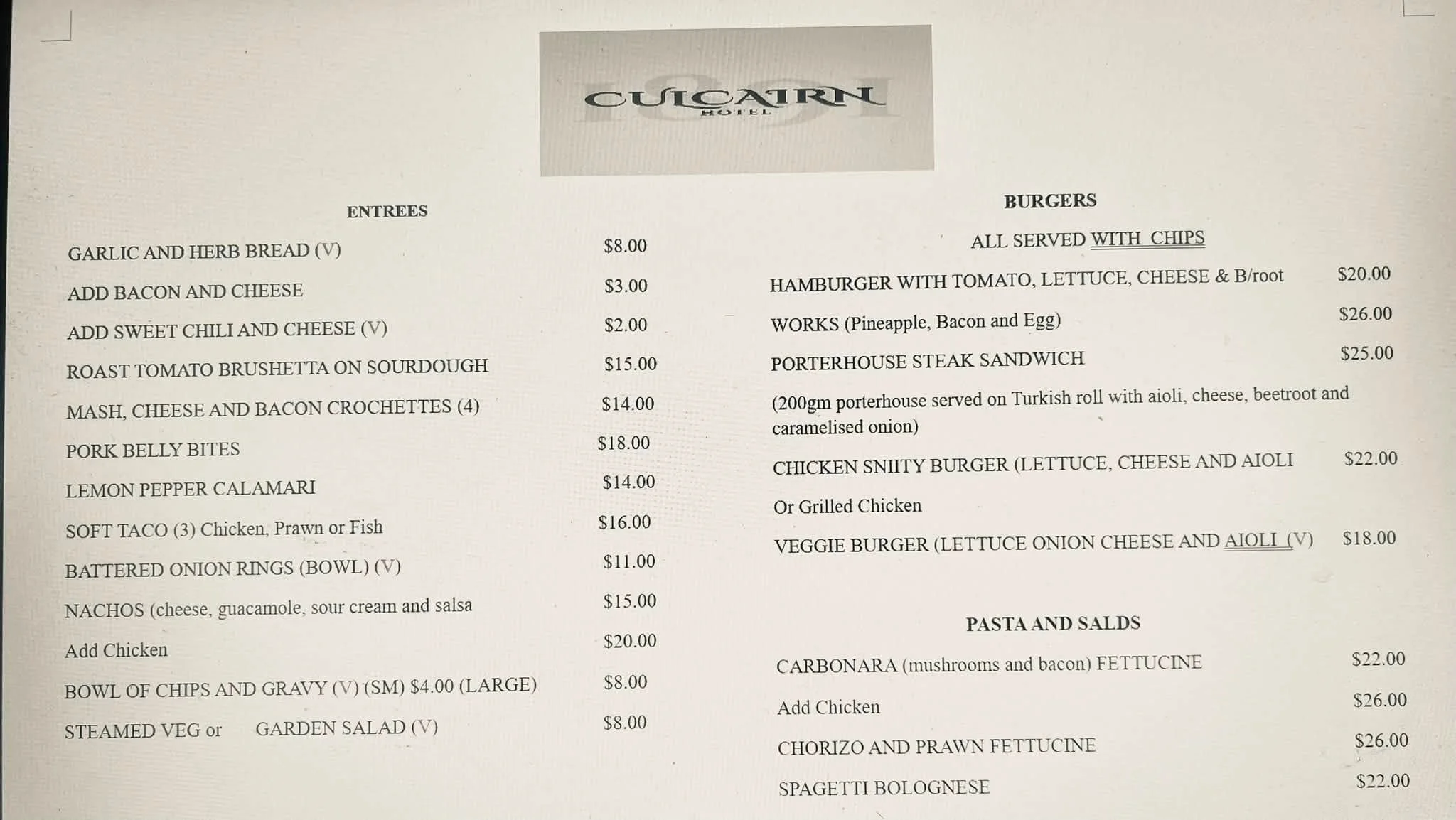 A restaurant menu featuring entrees and burgers with prices, including garlic and herb bread, bacon and cheese add-on, sweet chili and cheese, roast tomato bruschetta, mash, cheese and bacon croquettes, pork belly bites, lemon pepper calamari, soft t