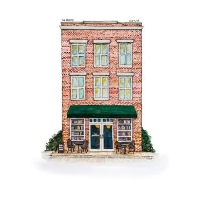 Three-story brick building with a storefront on the ground level, green awning, large windows, and outdoor seating with benches and small tables.