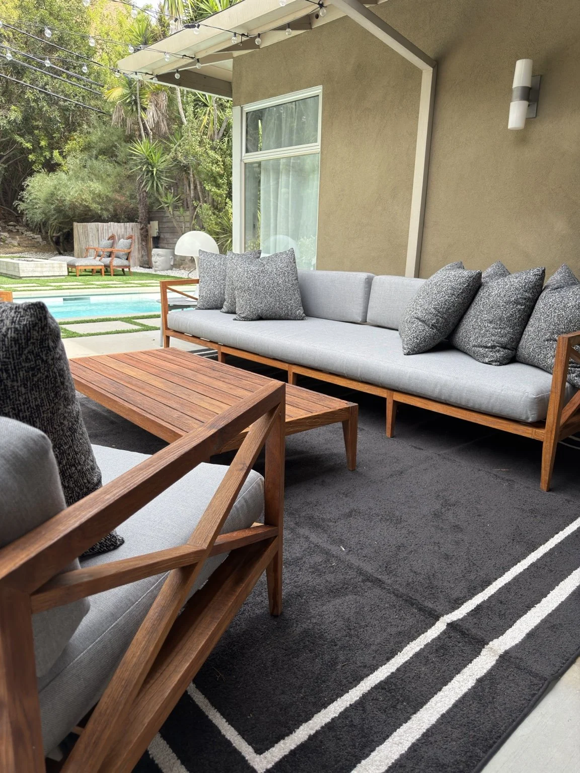 Restored teak sofa chairs and coffee table with new outdoor cushions