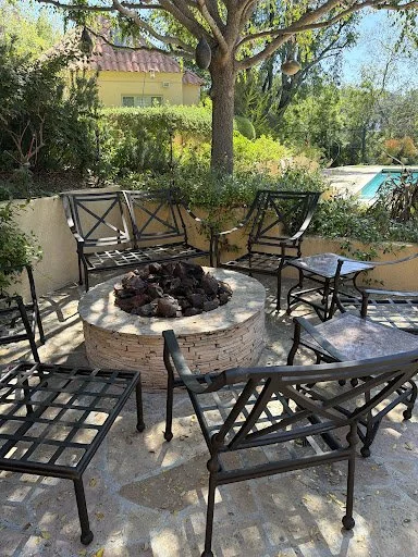 Restored aluminum patio furniture with renewed powder coating, glides, and hardware, featured in Jill Weiser's review.