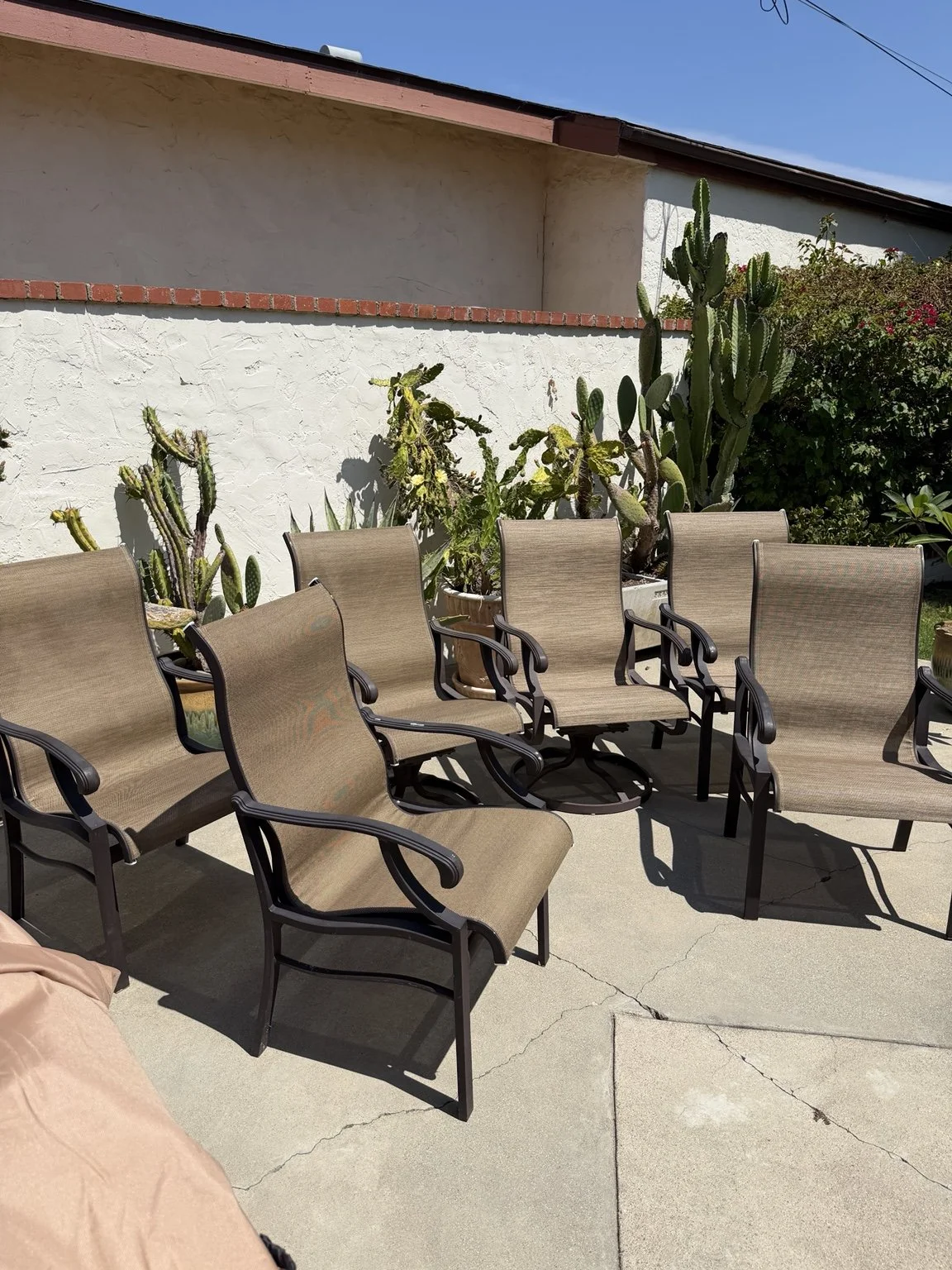 A finished brown sling patio set returned to a beautiful home in burbank