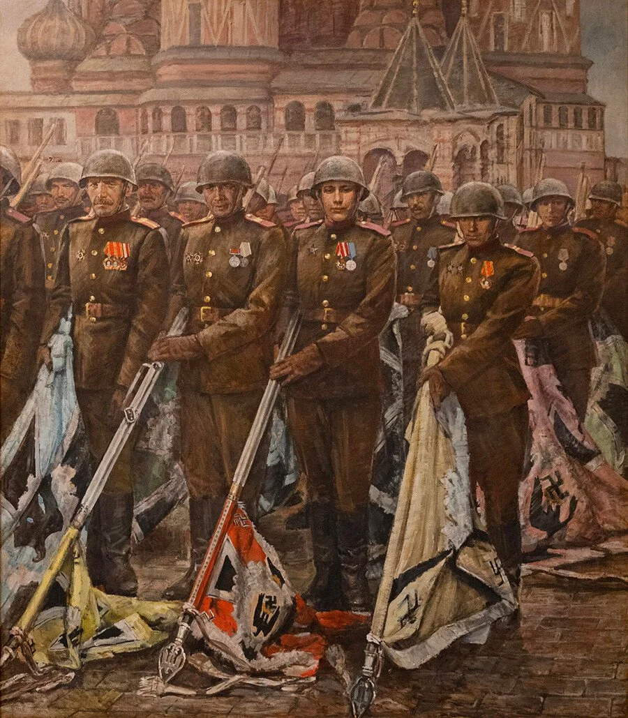 Soviet soldiers present Nazi German flags to the people of the Soviet Union during their Victory Day parade following the Great Patriotic War