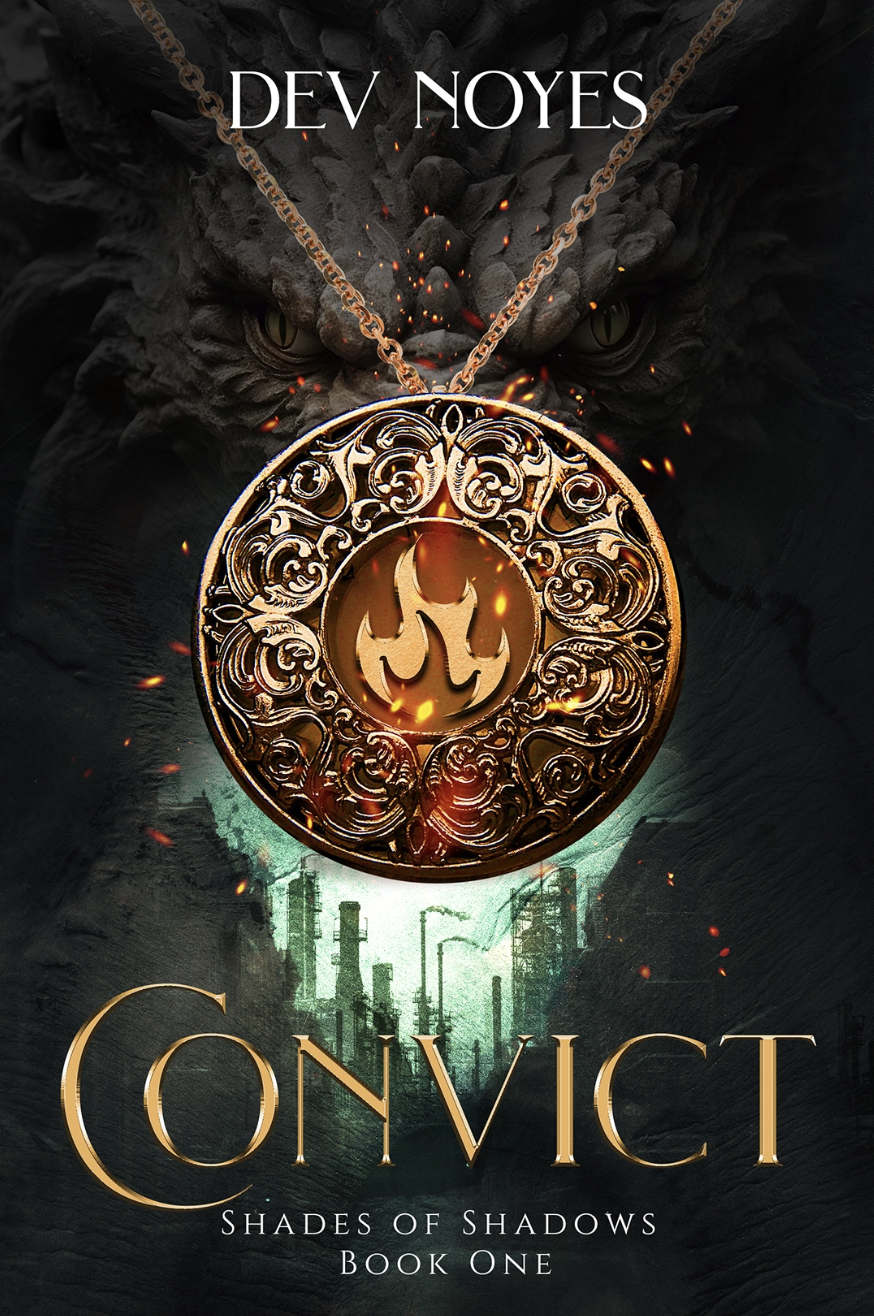 Book cover for "ConvicT: Shades of Shadows Book One" by Dev Noyes. Features a dark background with a large, ornate gold pendant in the center, glowing with orange flames and sparks. Behind the pendant, there is a faint image of a dragon's head with glowing eyes, and industrial structures with smokestacks emitting smoke, creating a dark, intense atmosphere.