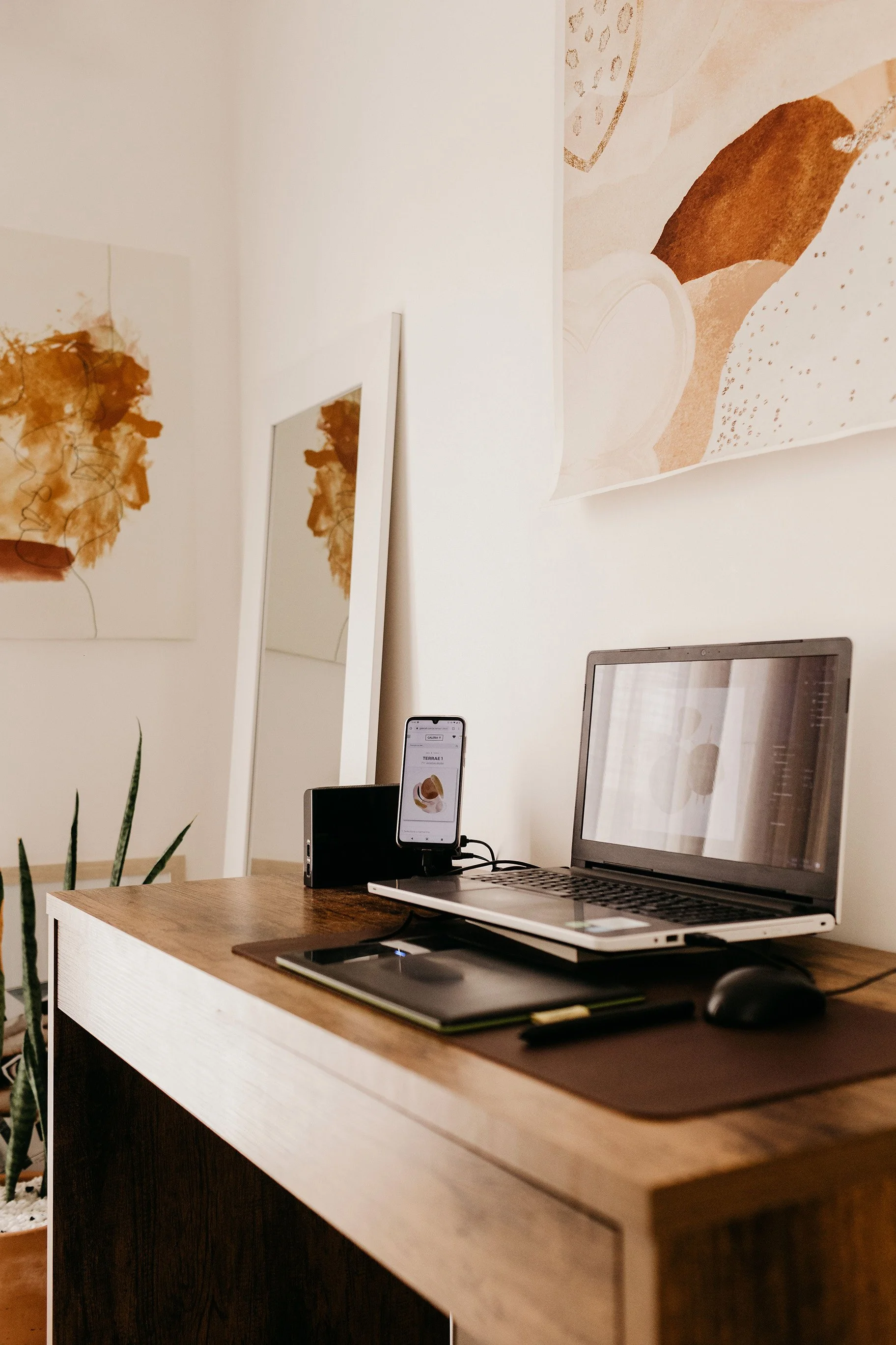 A wooden desk and computer in a home office.