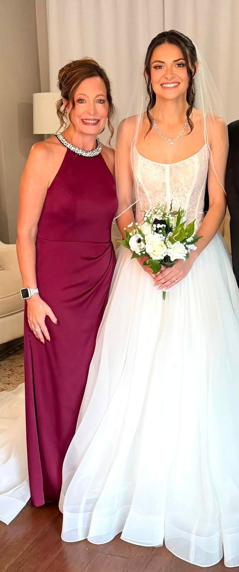 A bride and mother of the bride posing for a picture to show the makeup done by Makeup by Isabel Korin and how the makeup coordinated with the dresses very well. 